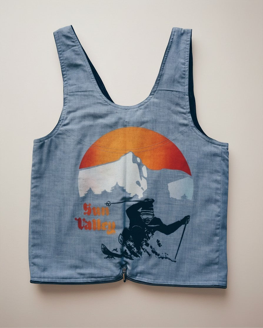 Hue Labs reversible Sun Valley vest bag made from upcycled blue fabric with a vintage ski graphic and metal zipper.