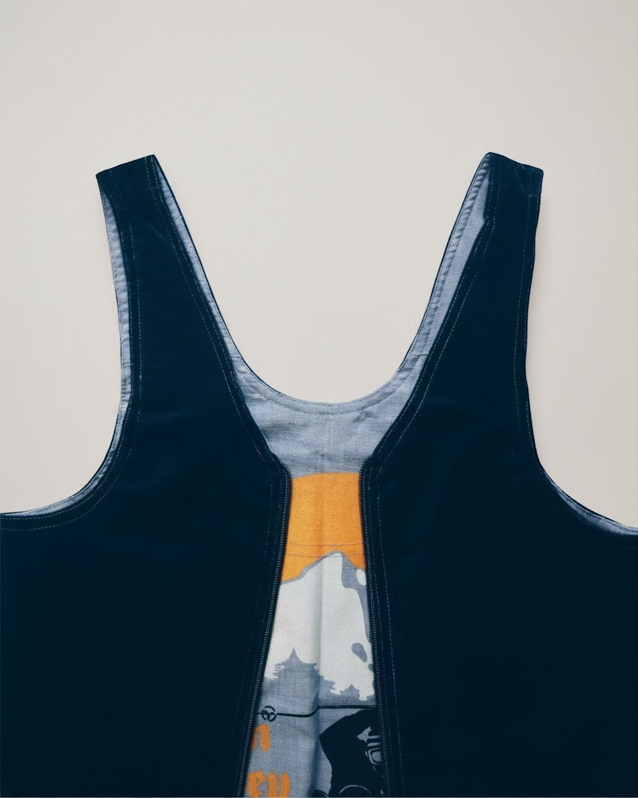 Hue Labs reversible Sun Valley vest bag in dark navy and graphic print upcycled fabric with a silver metal zipper.