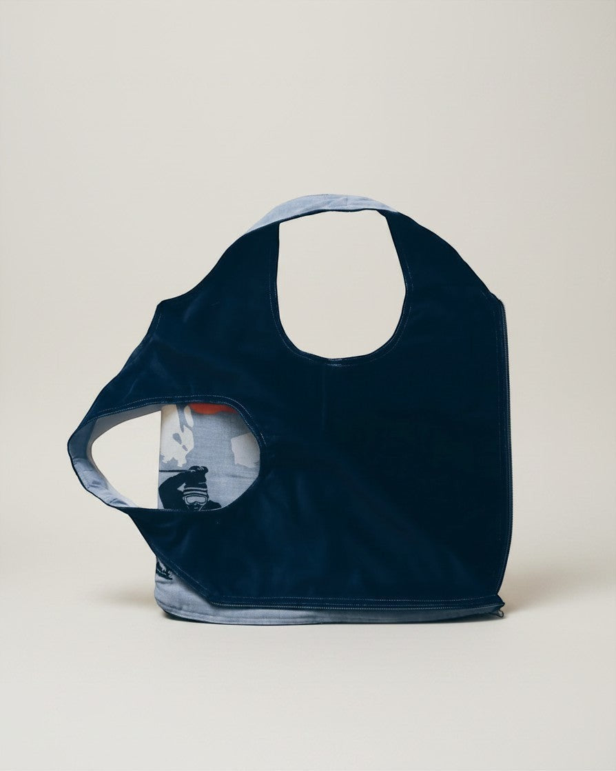 Hue Labs Sun Valley reversible vest bag in dark navy and patterned upcycled fabric with a gun metal zipper.