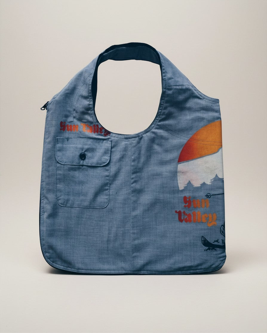 Hue Labs Sun Valley reversible vest bag in blue upcycled fabric with graphic print and front pocket