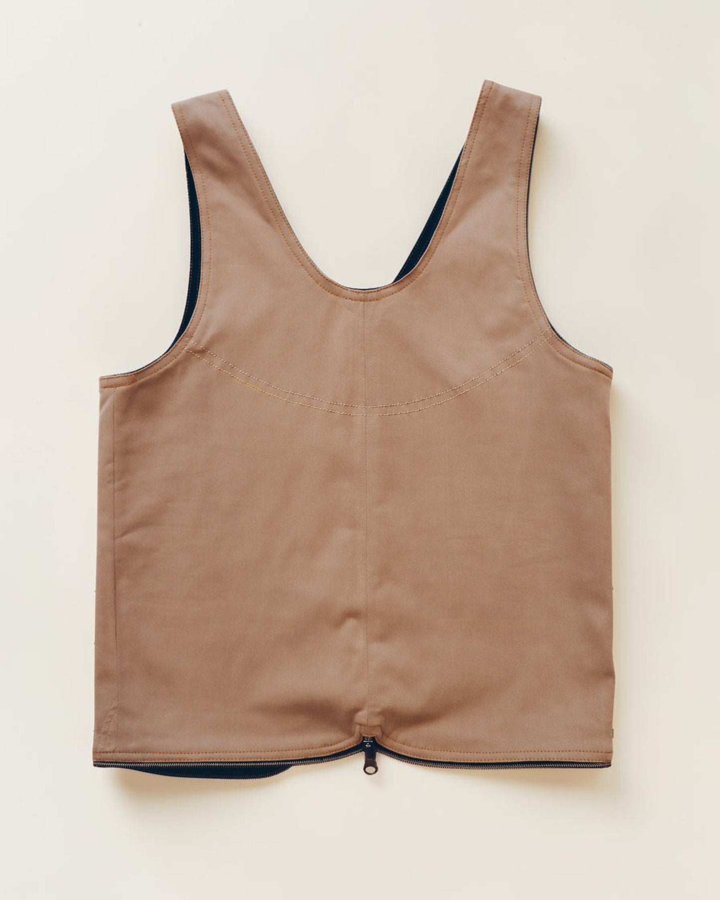 Hue Labs tan minimalist vest with a front zipper closure and structured sleeveless design on a neutral background.