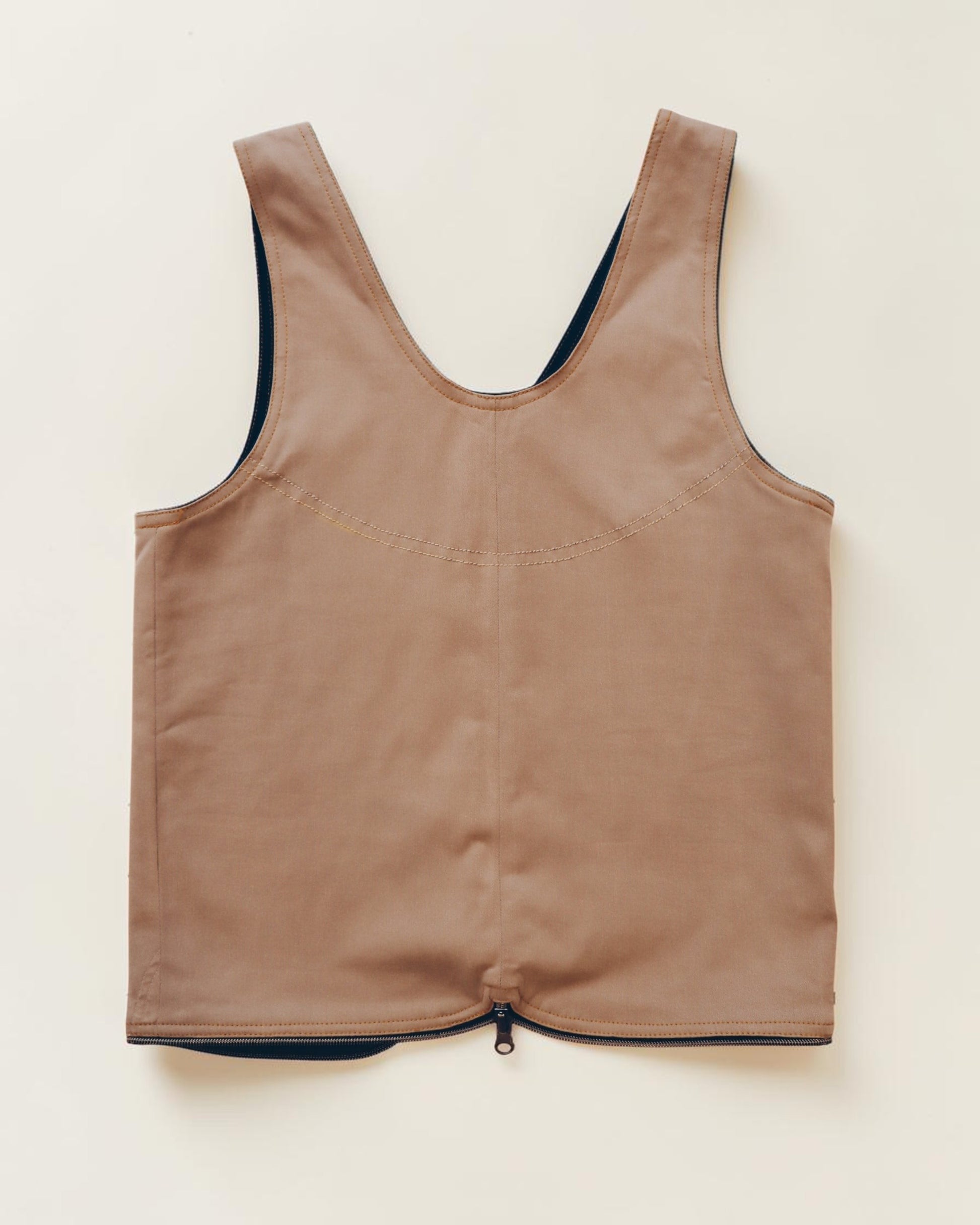 Hue Labs tan minimalist vest with a front zipper closure and structured sleeveless design on a neutral background.