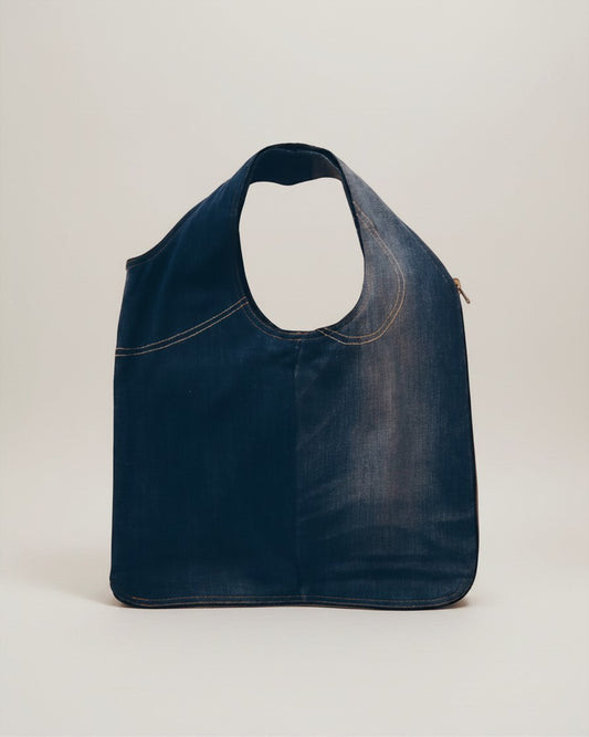 Hue Labs medium wash upcycled denim vest bag with a versatile reversible design and gun metal silver zipper