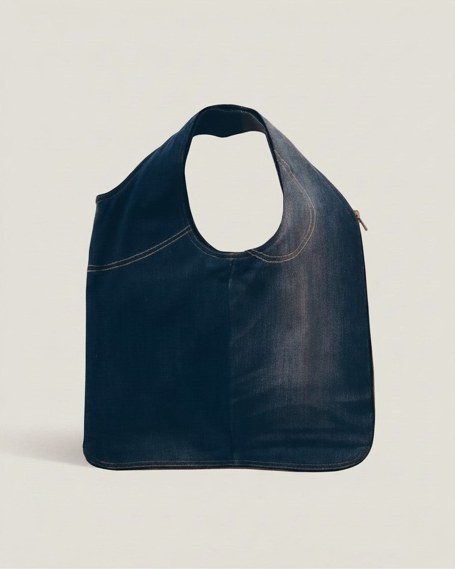 Hue Labs medium wash upcycled denim vest bag with a reversible design and gun metal silver zipper
