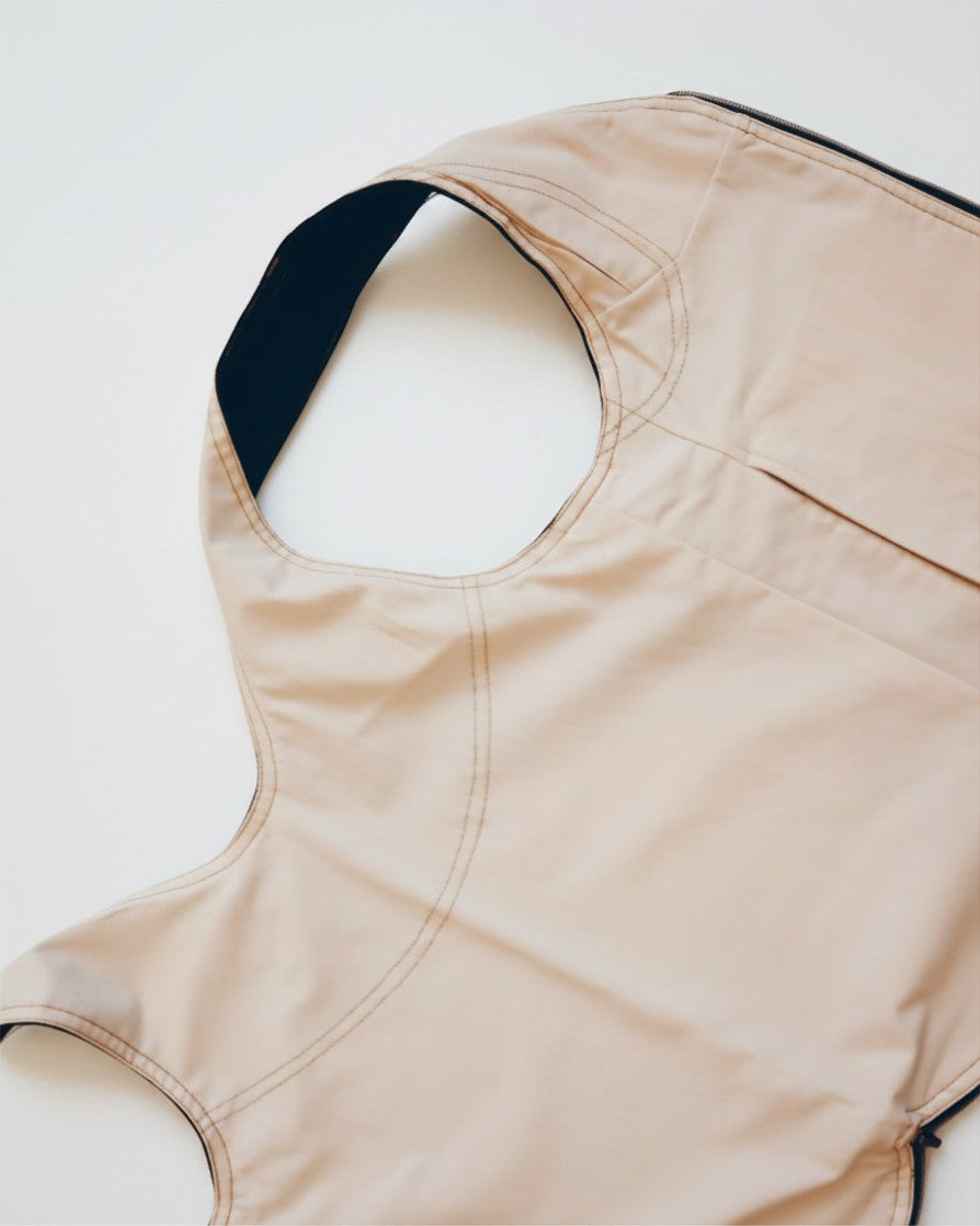 Hue Labs reversible white vest bag made from upcycled materials with a gun metal zipper detail
